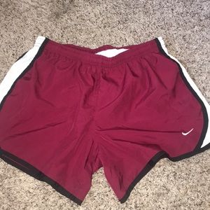 Maroon Nike rubbing shorts